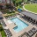 Resort-style swimming pool with lounge seating
