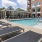 Resort-style swimming pool with lounge seating
