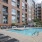 Resort-style swimming pool with lounge seating