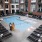 women walk around outdoor pool area