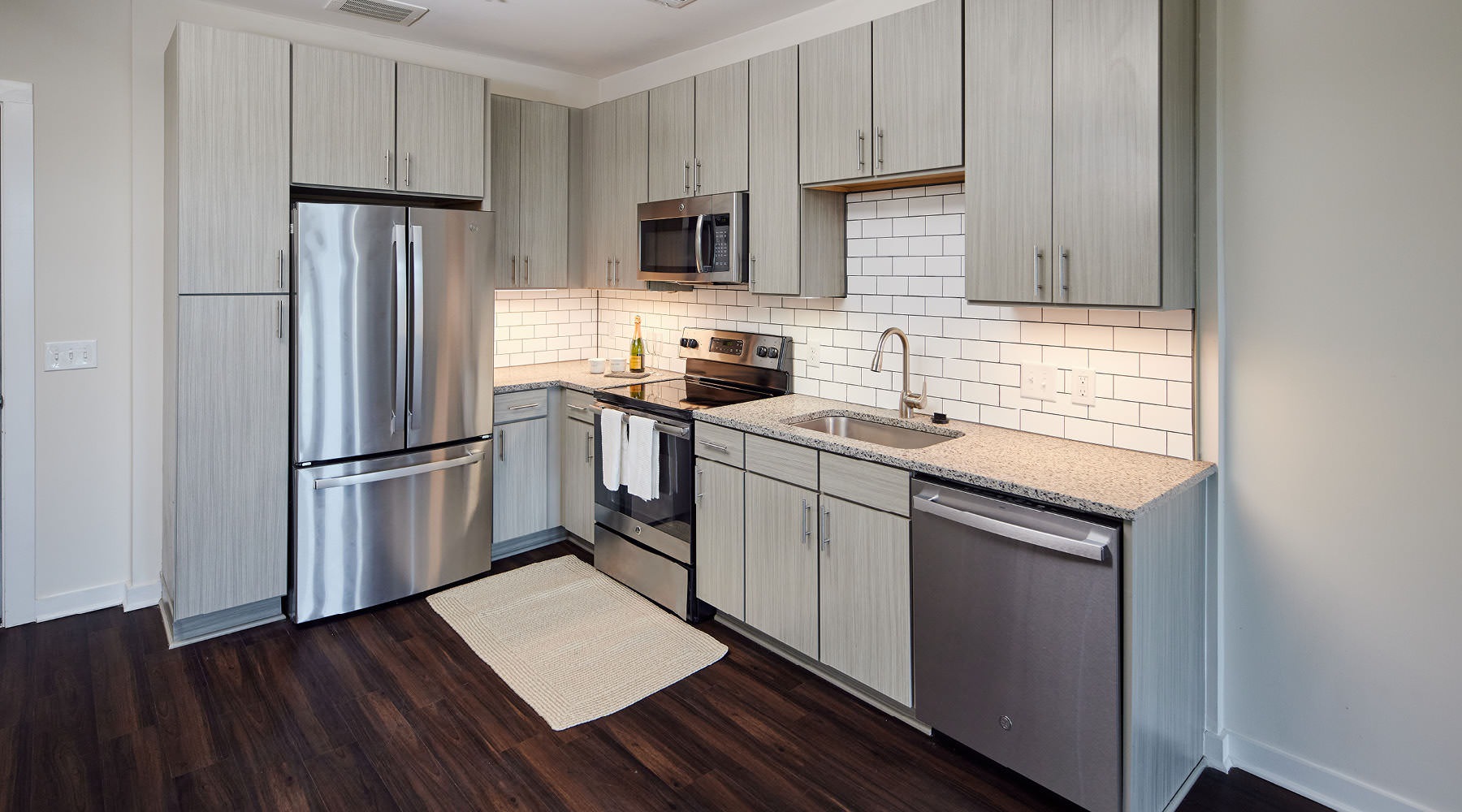 LUXURY APARTMENTS IN DURHAM, NC open kitchen with under cabinet lighting